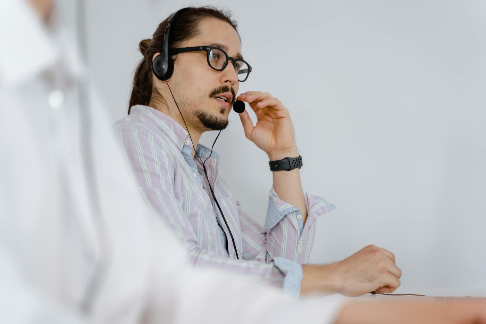 Support agent handling customer tickets at a help desk